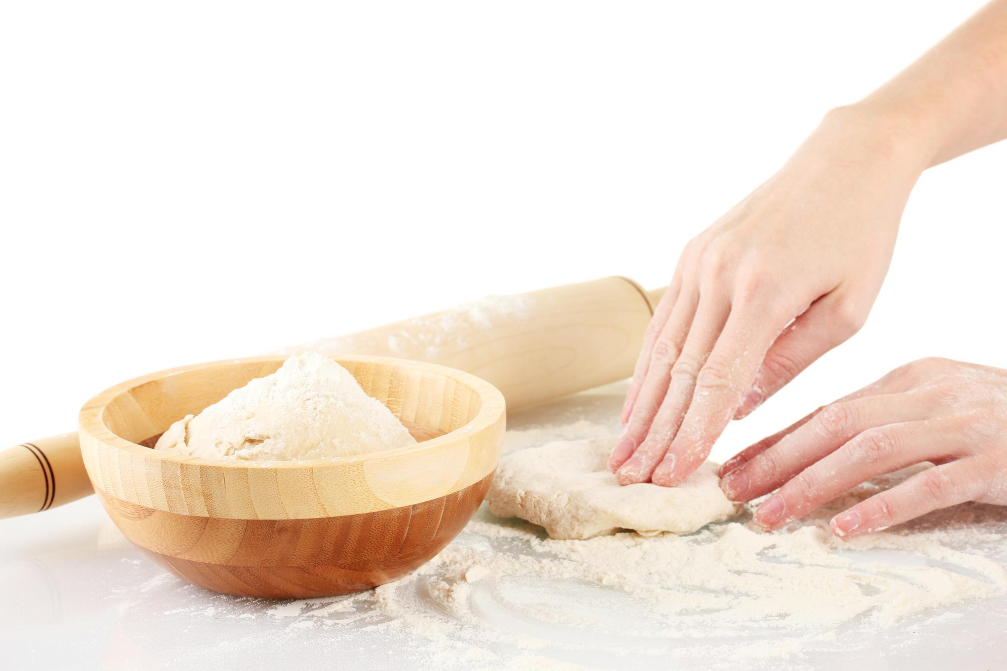 Student kneading dough in class